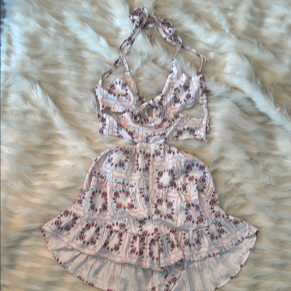 Pretty Garbage White and Red Romper with cut out Halter Neck and Ruffled Shorts